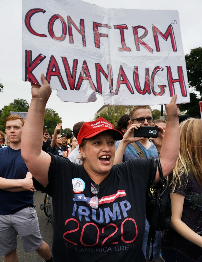 A pro-Trump, pro-Kavanaugh protester is among hundreds of protesters who flooded the front of the U.S. Capital and Supreme Court as the U.S. Senate voted to confirm Judge Brett Kavanaugh to a seat on the U.S. Supreme Court. Police arrested dozens during the protests. Photo: Jay Mallin